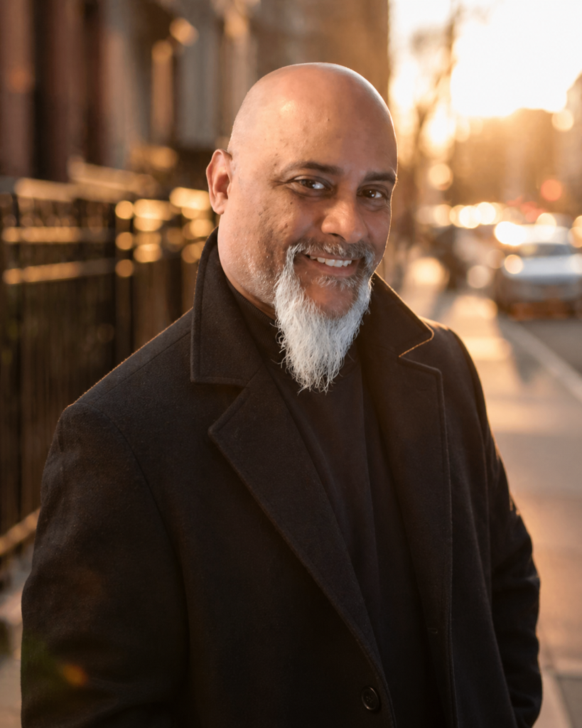 Author David Garcia smiling outdoors at sunset